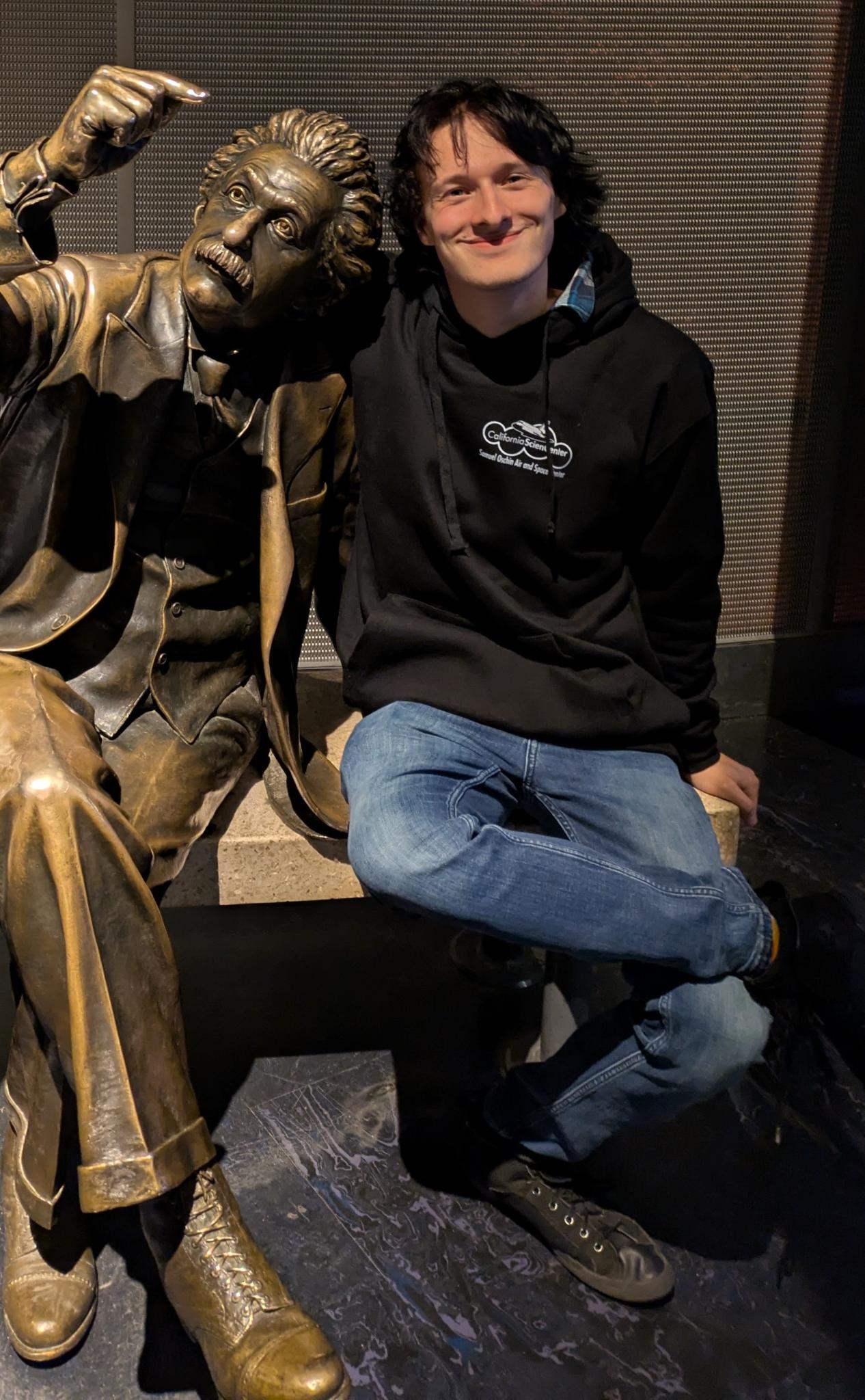 Sitting with Einstein statue at the Griffith Observatory